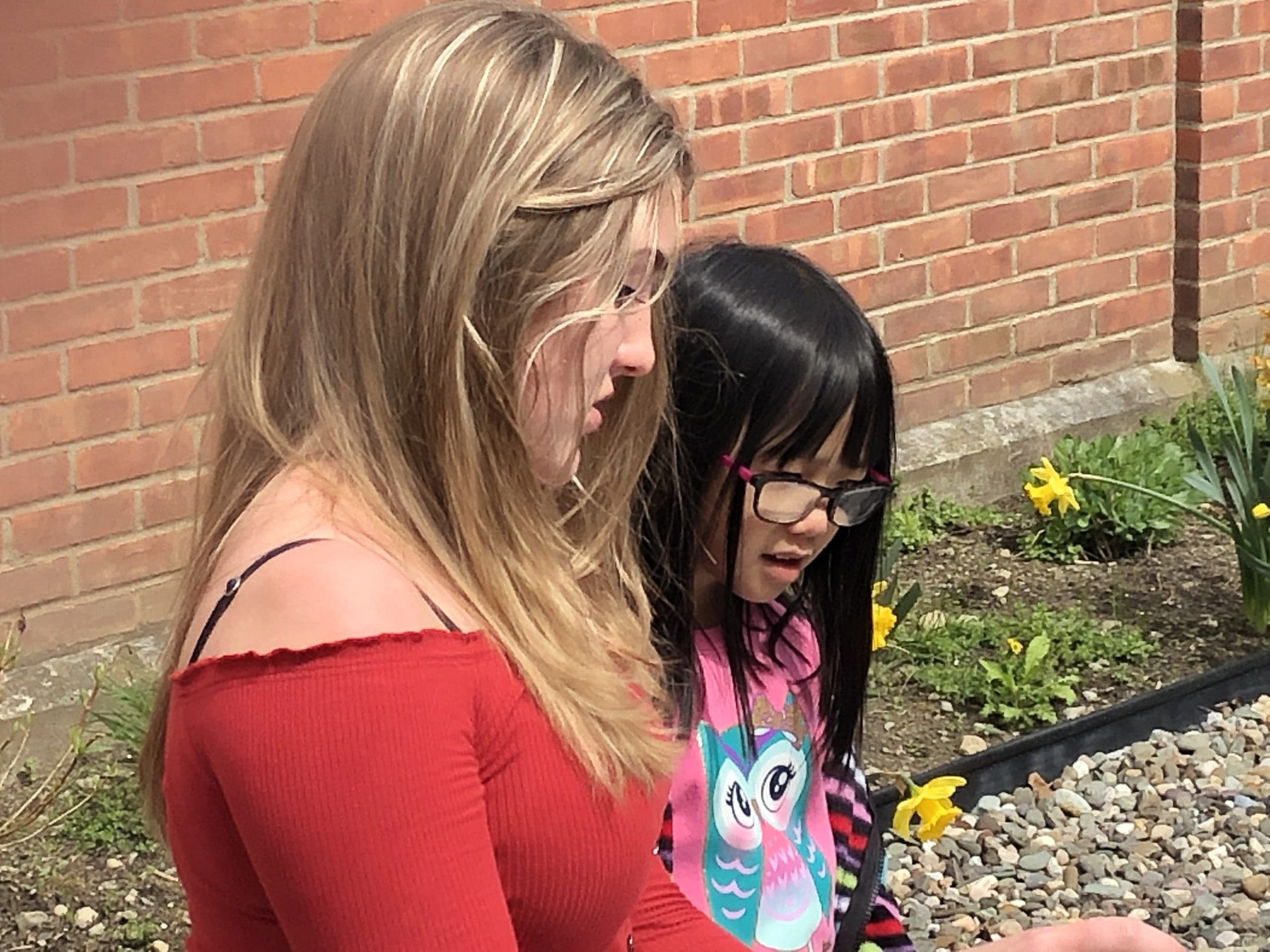 student reading to child