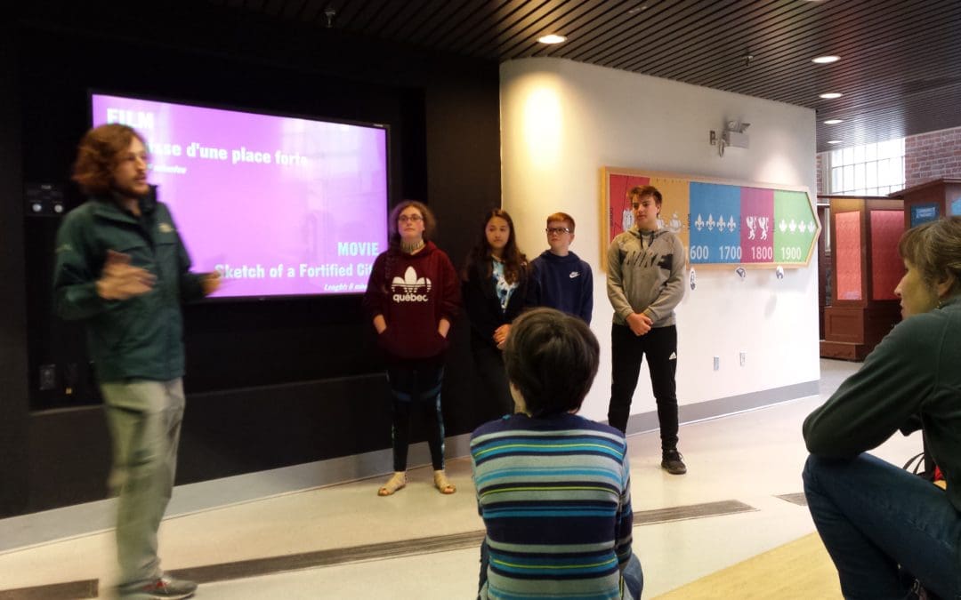 students listen to a presenter