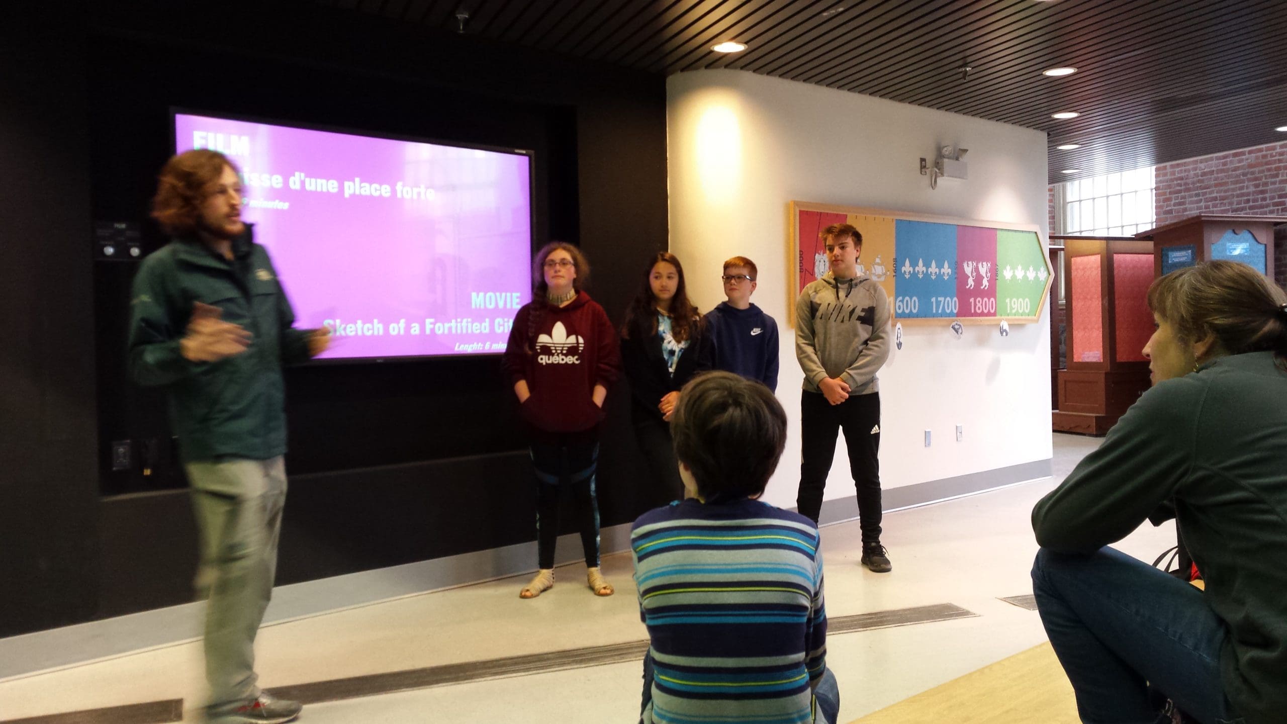 students listen to a presenter