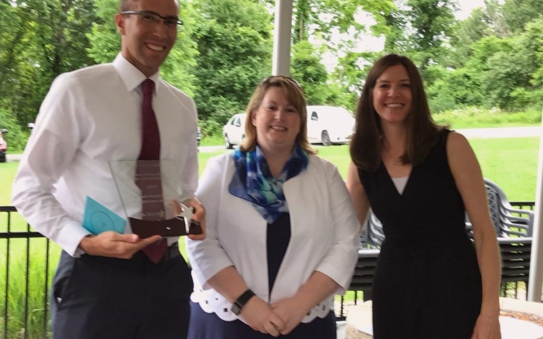 Rob Messia accepts award