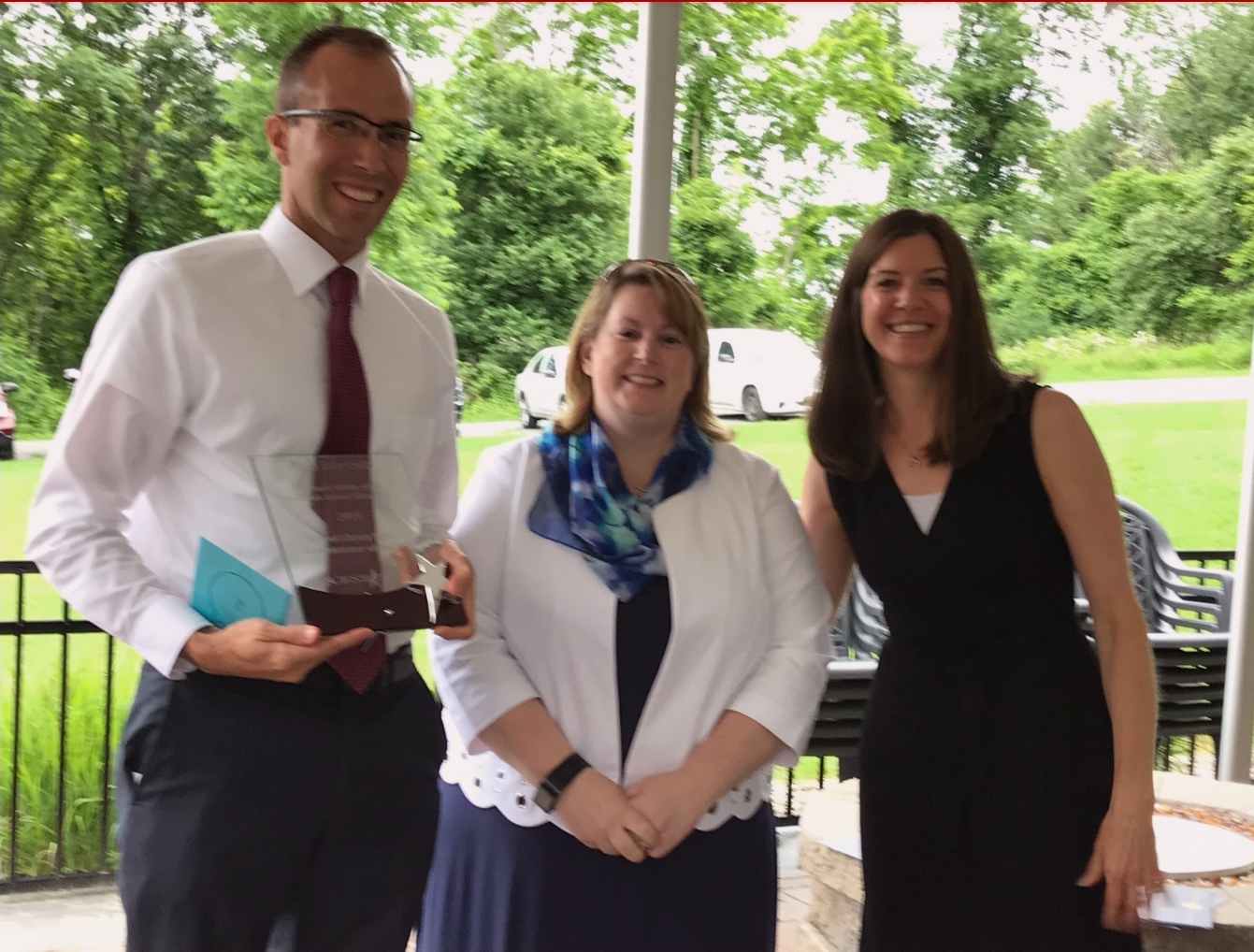 Rob Messia accepts award