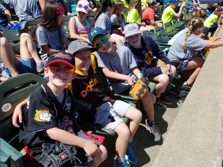 students watch a baseball game