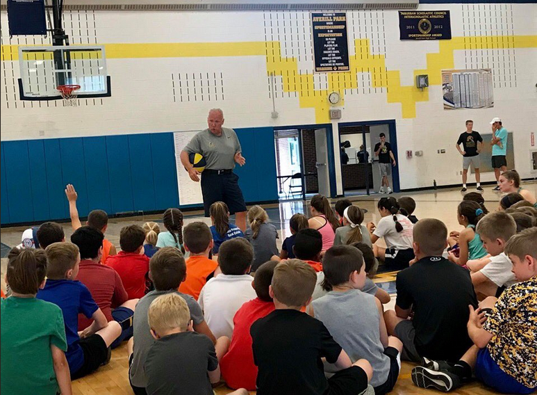 coach talking to students