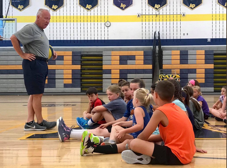 coach talking to students