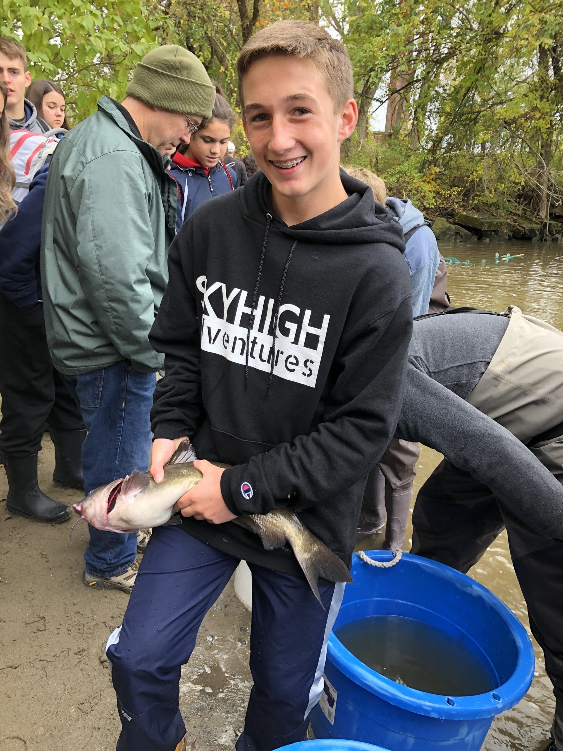 student holding fish