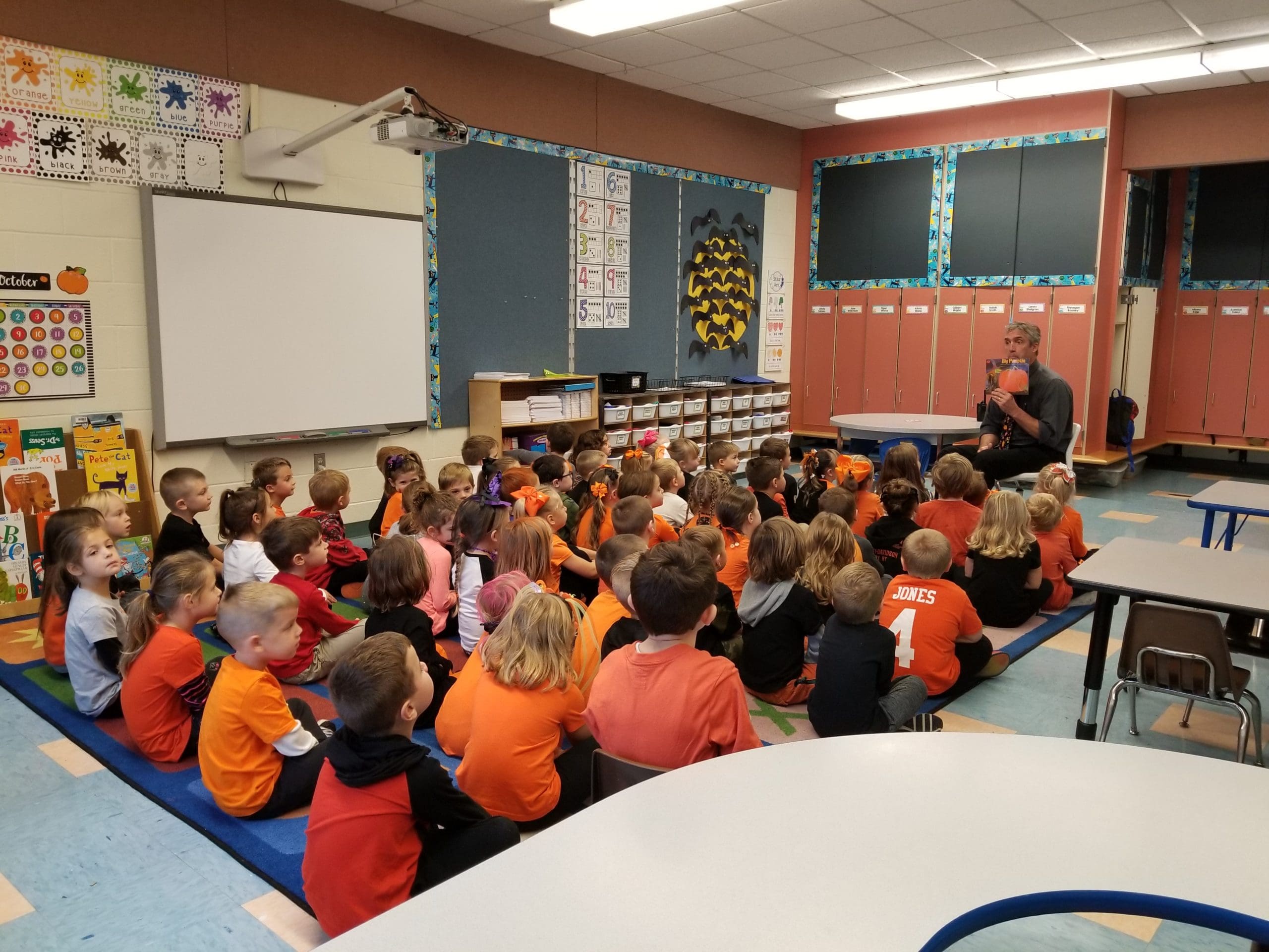 principal reading to students