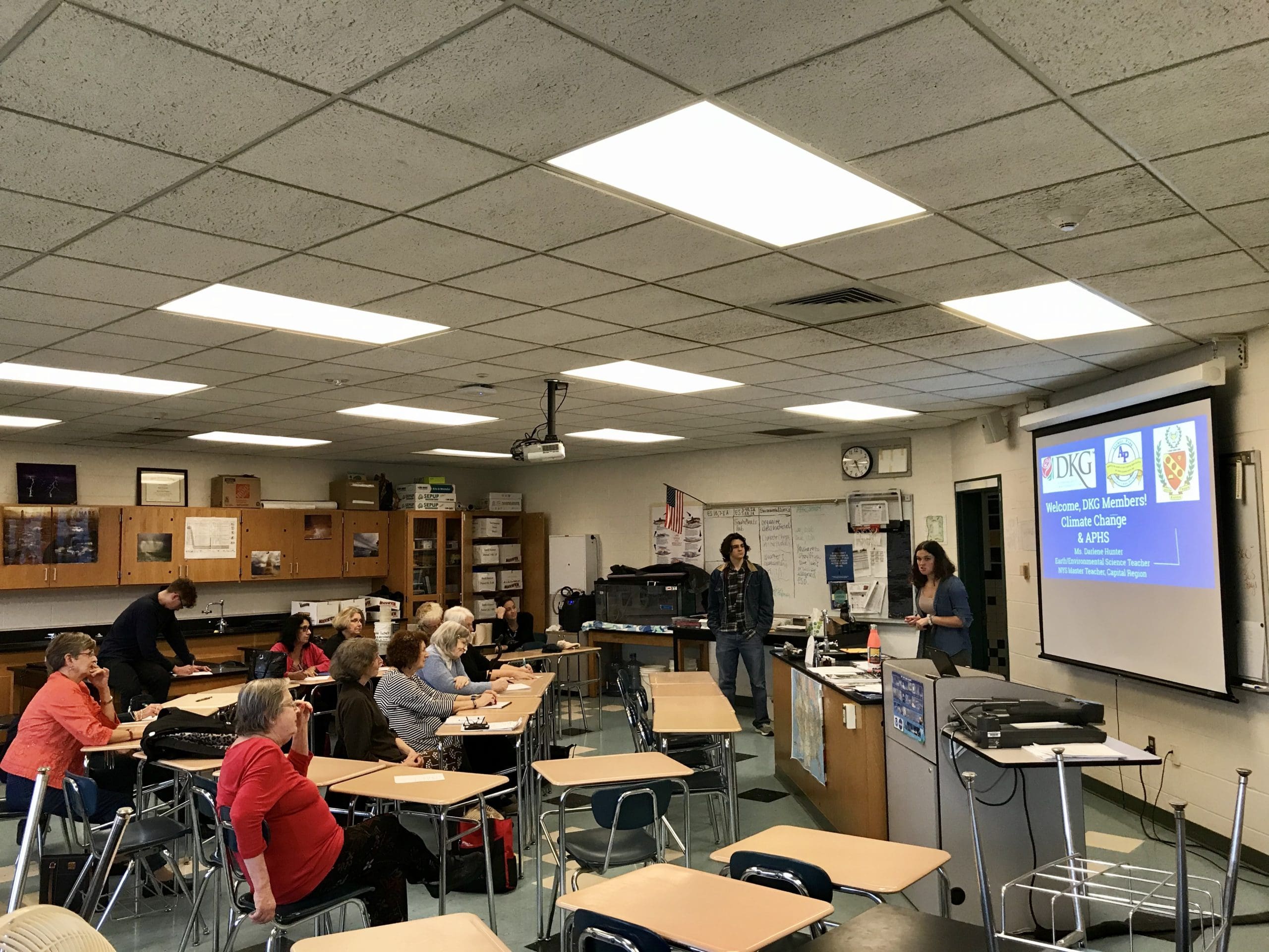 students talk to a group