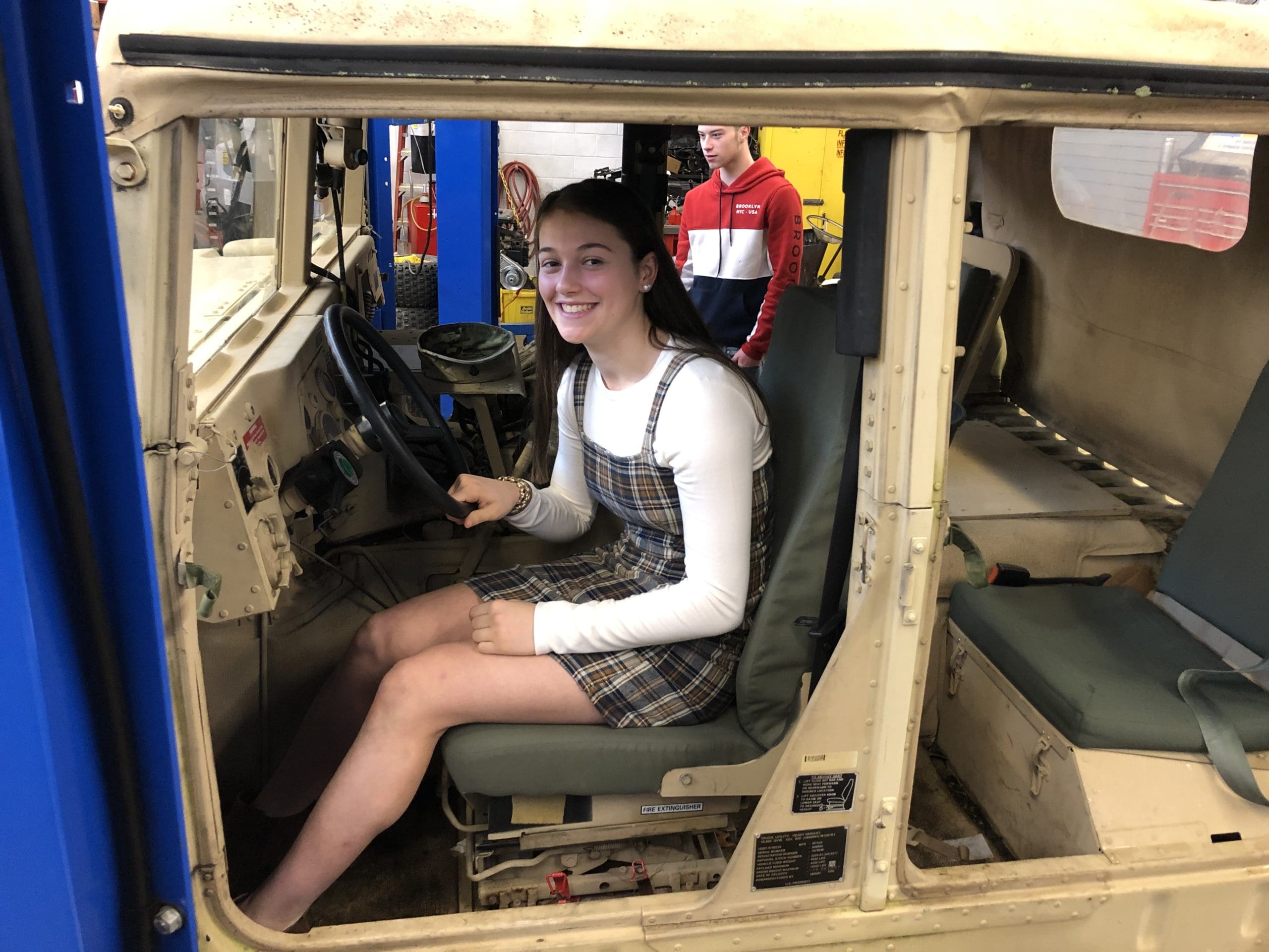 student in Humvee