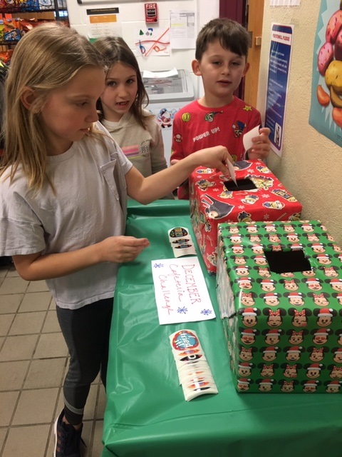 students place cards into box