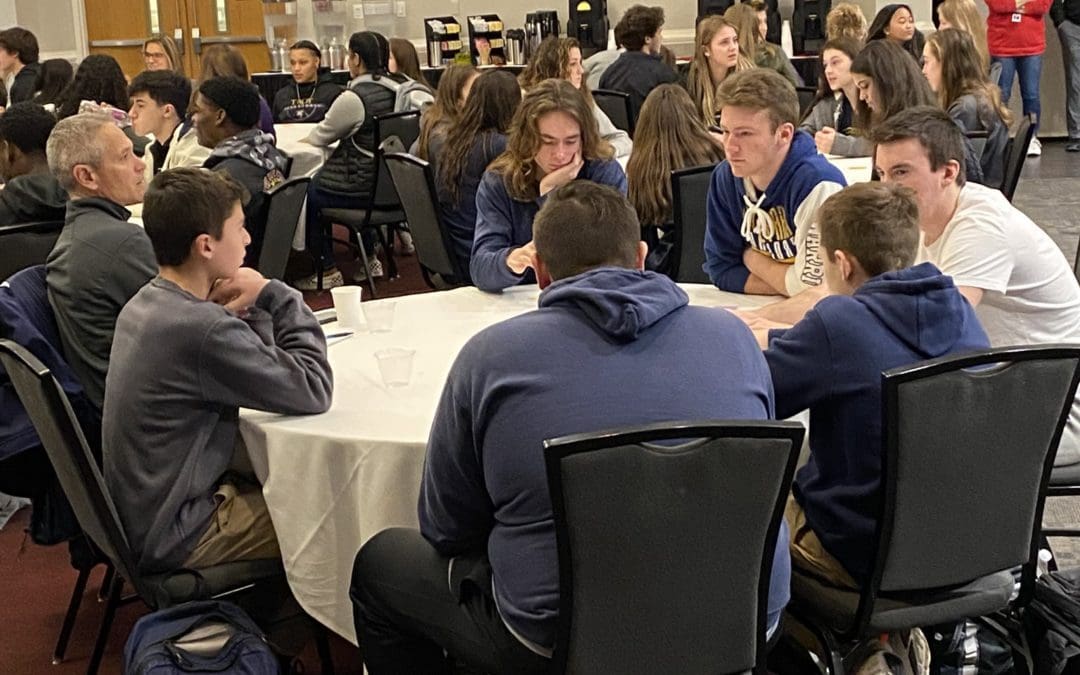 students at meeting