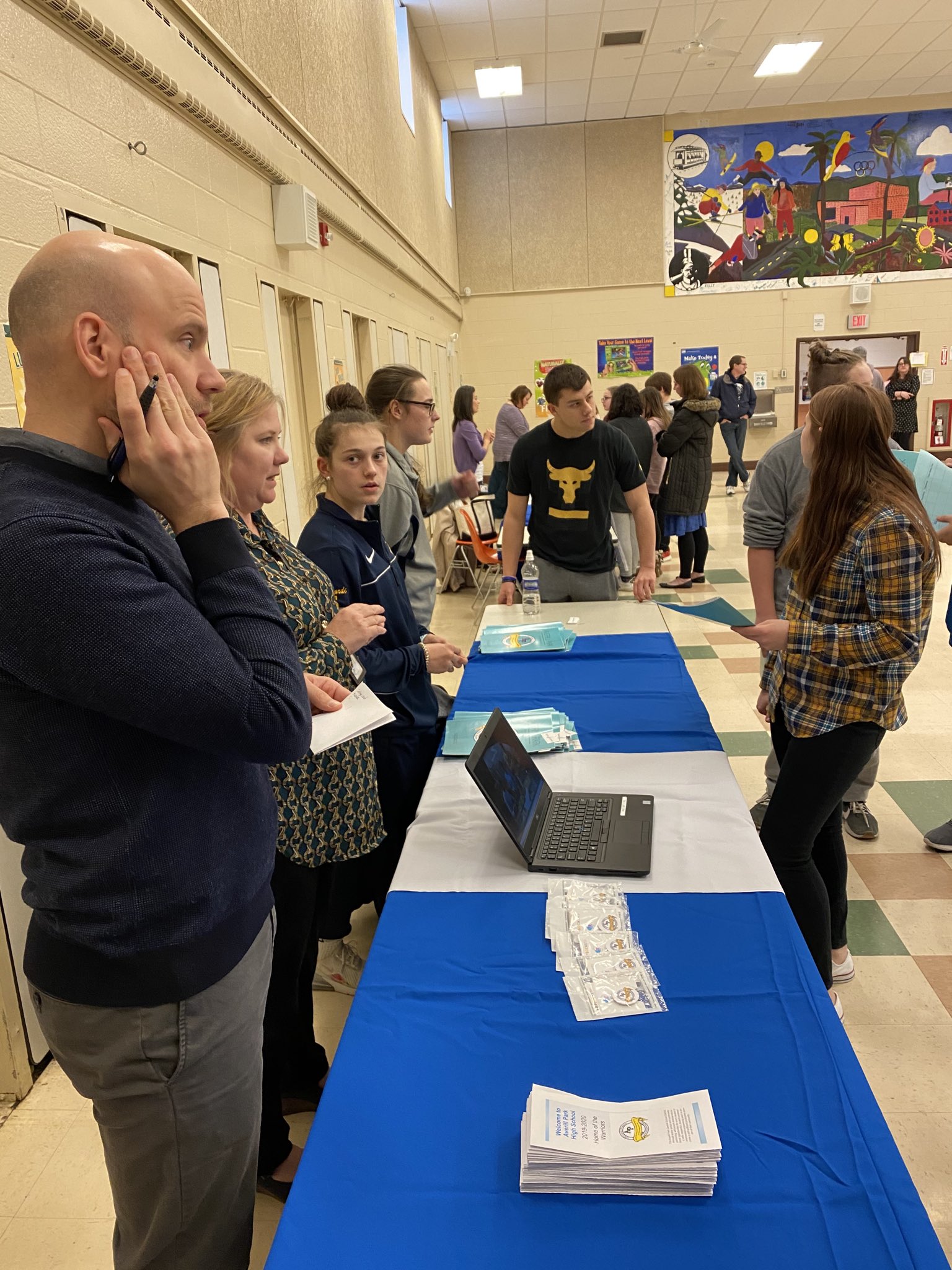 students and staff at high school fair