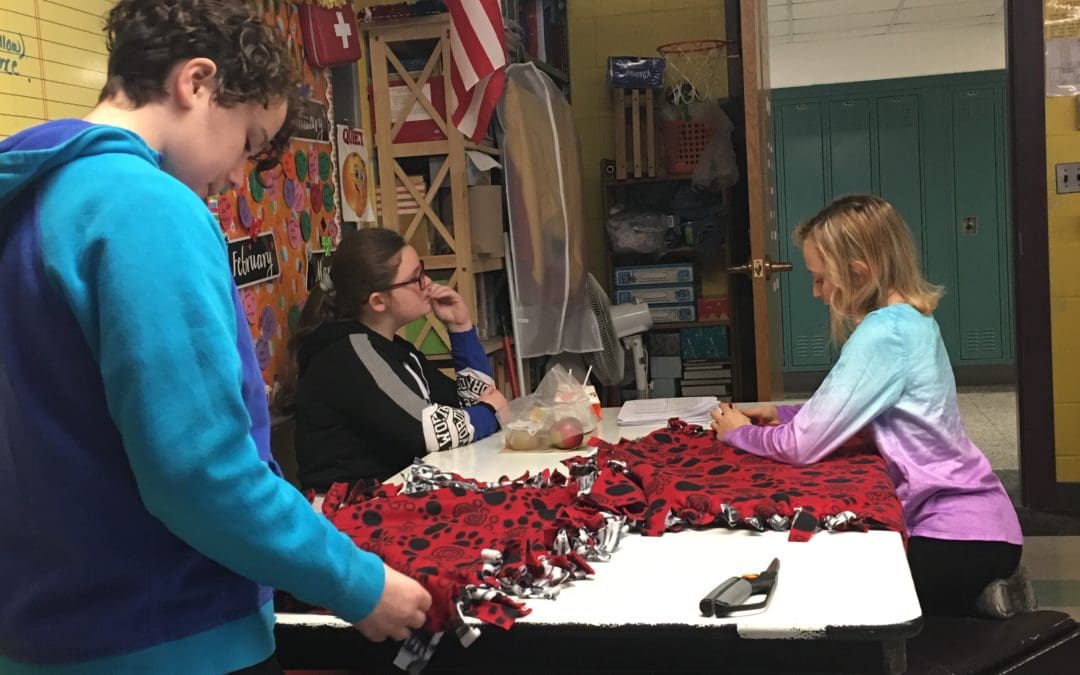 sudents working on making blankets