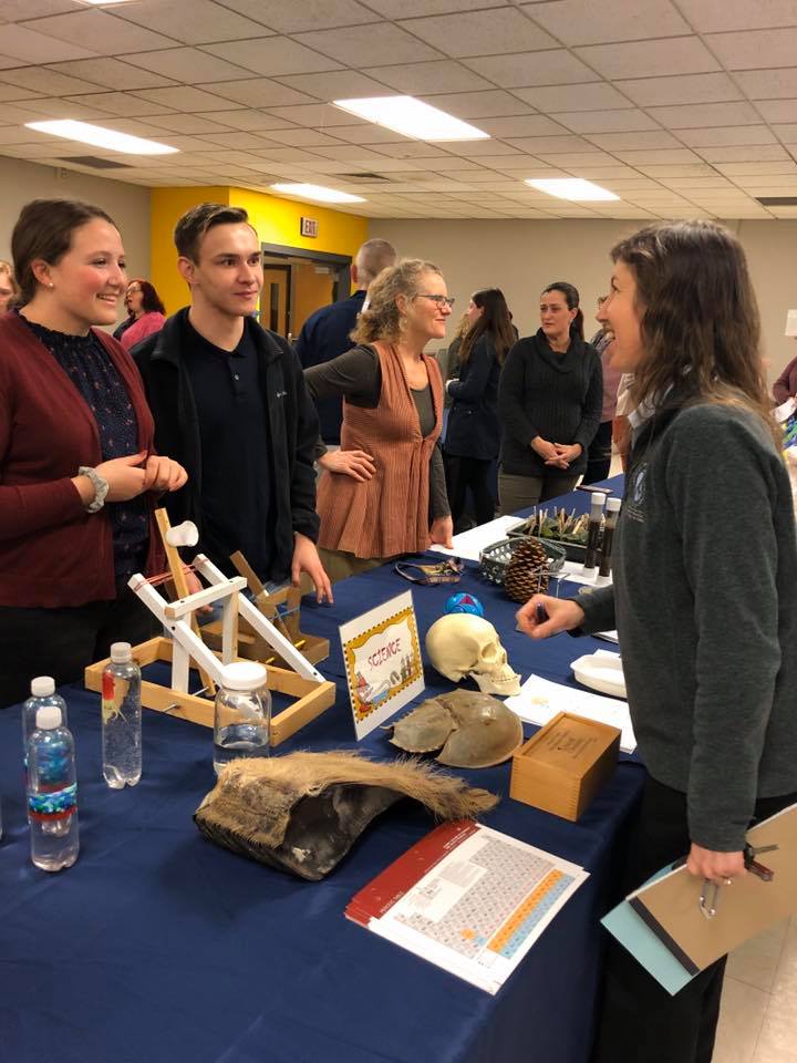 students talking to teachers