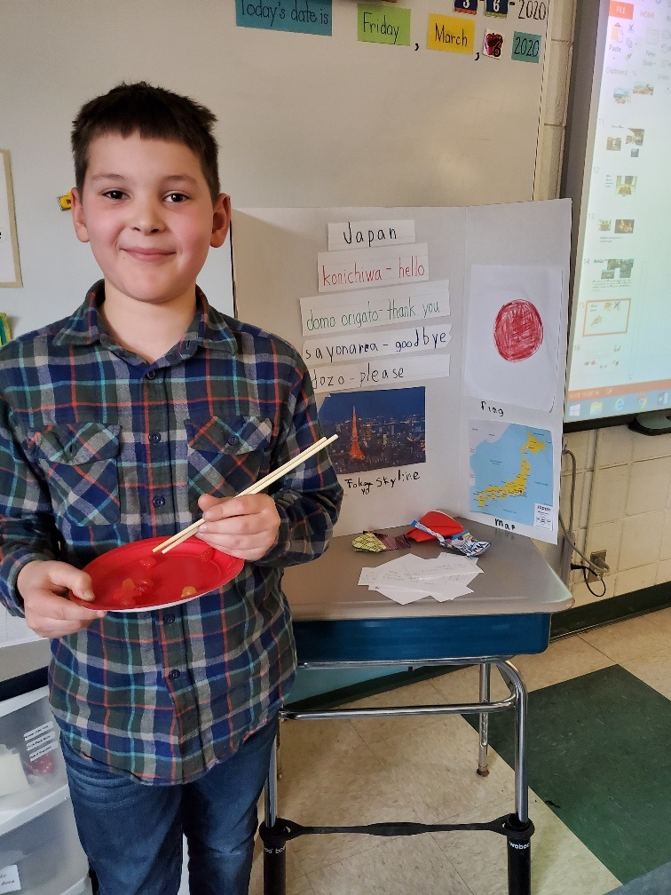 student using chop sticks