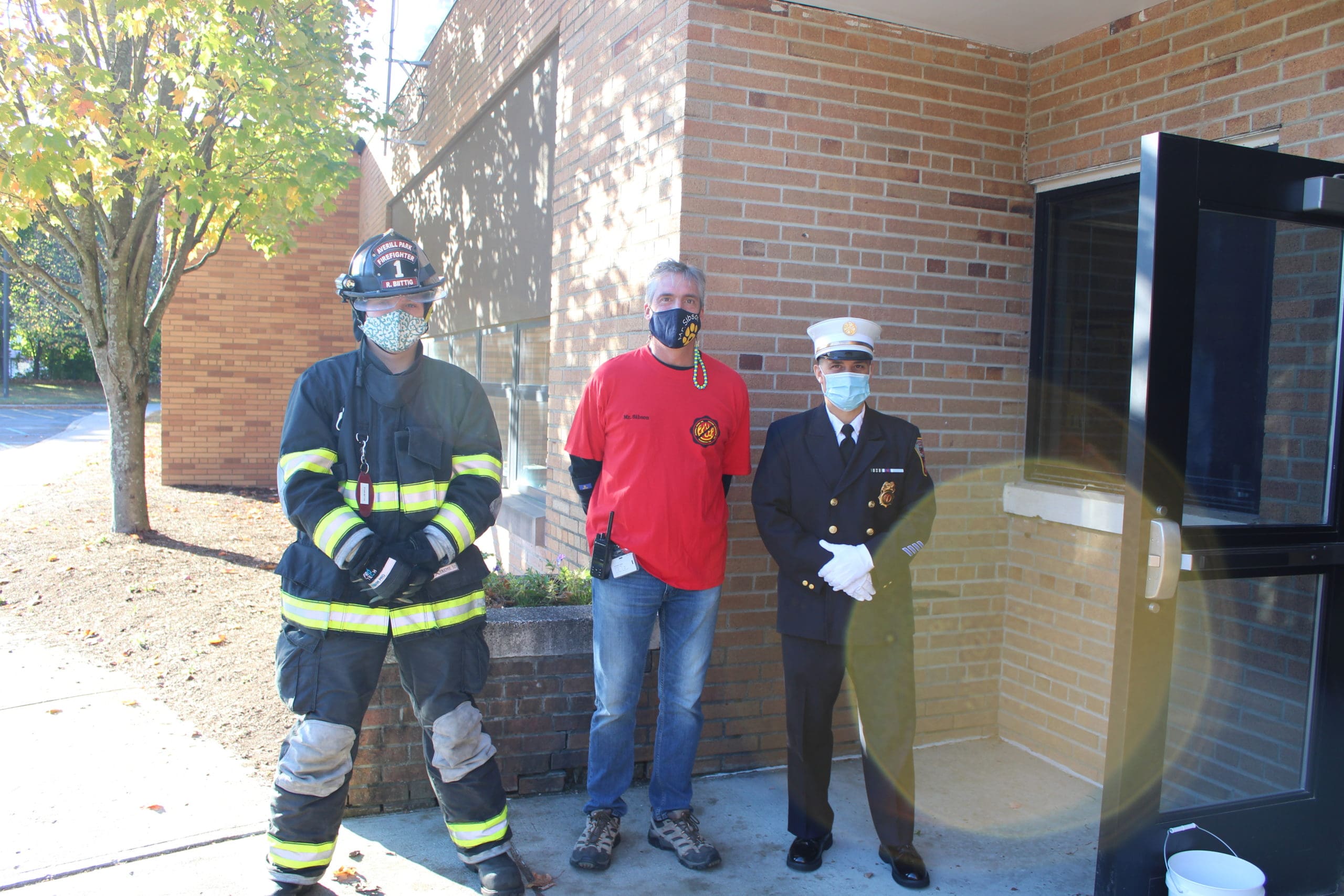 firefighters with principal