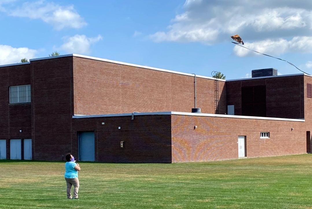 student flying kite