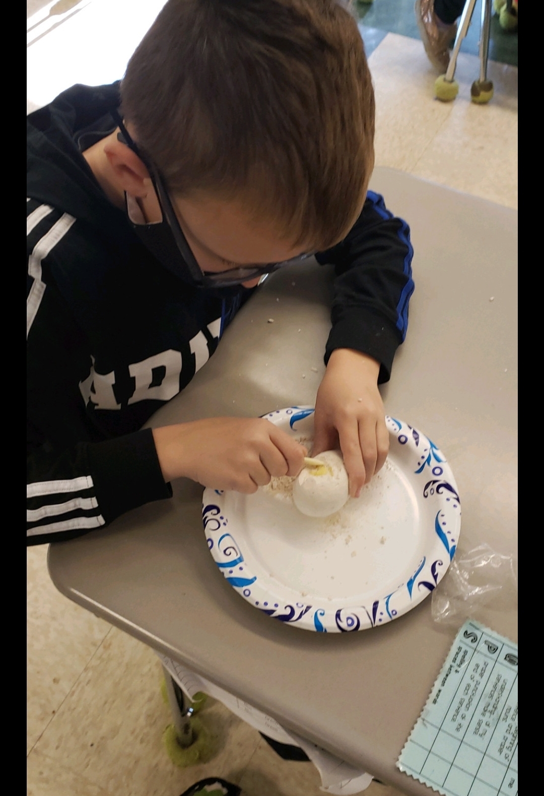 student working on fossil