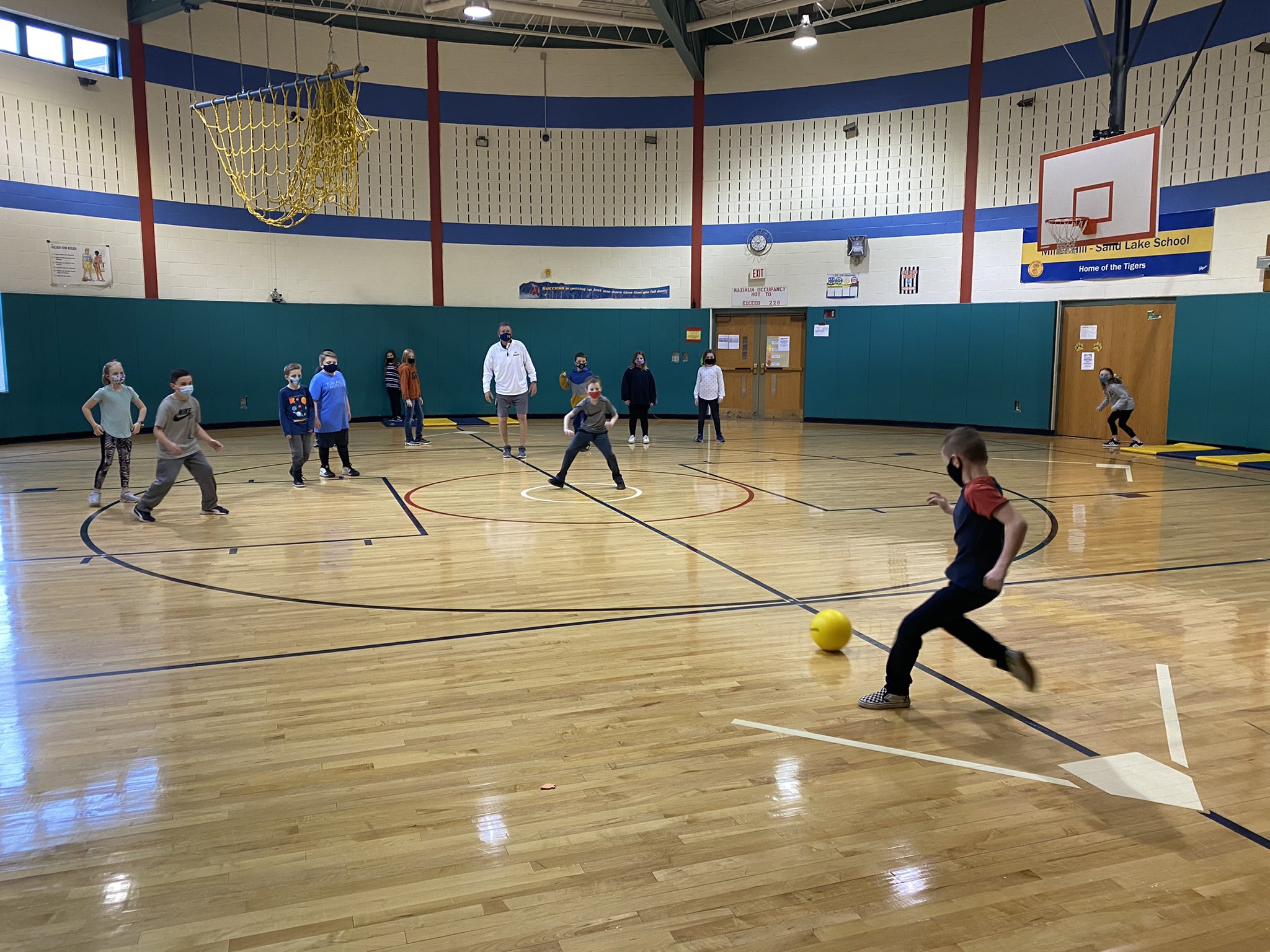 students playing in gymnasium