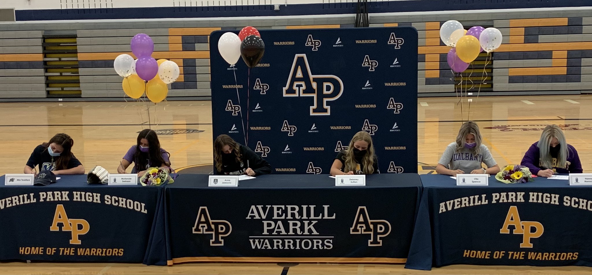 students signing letters