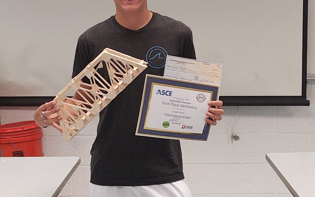 Joe with bridge and award