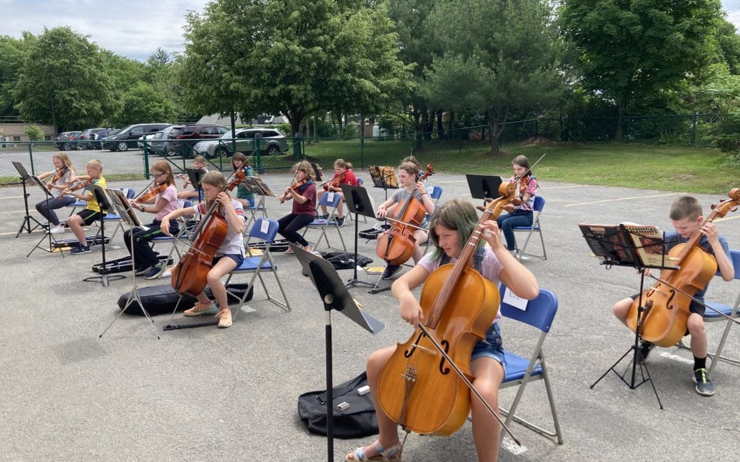 students playing music outside
