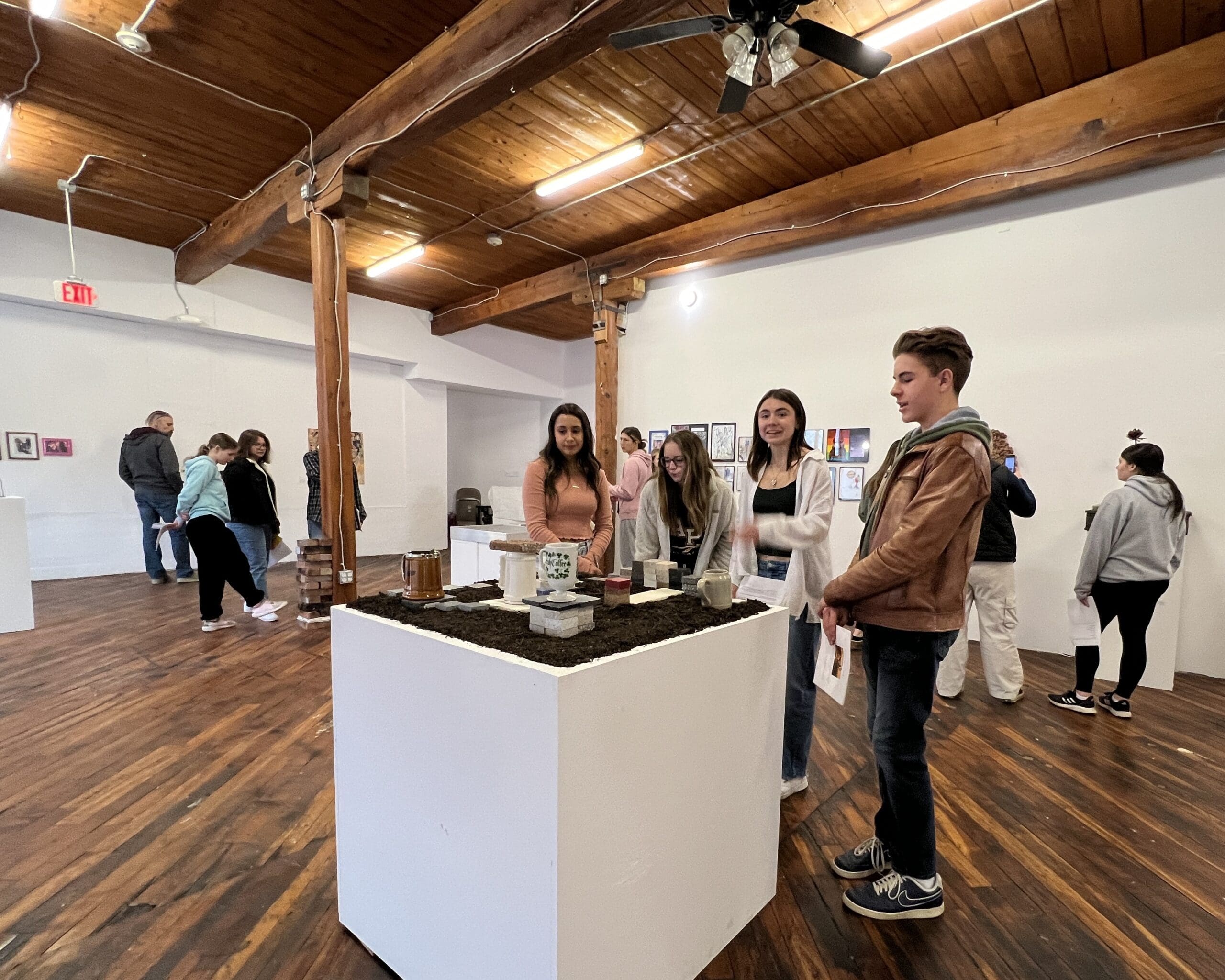 students at art exhibit