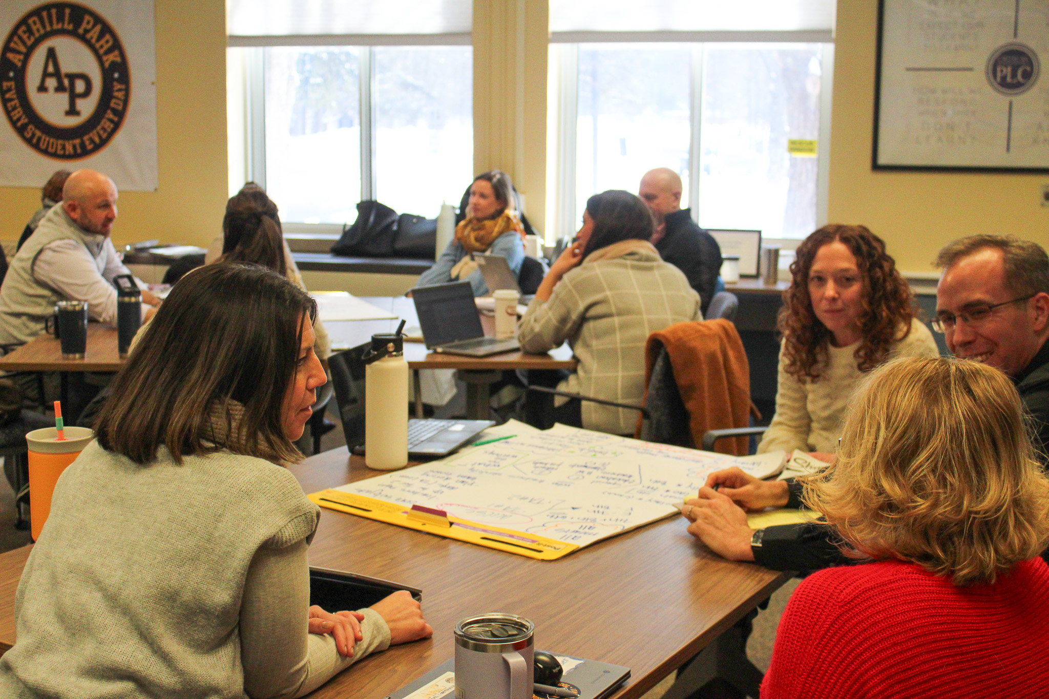 District leaders conversing with each other during MTSS workshop.